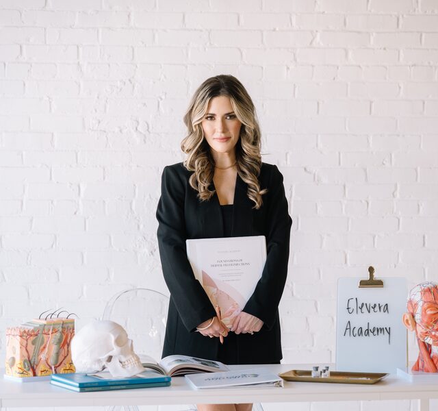 Kristin Cadavos with Elevera Academy training materials